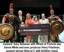 Gary Selesner, Wheel of Fortune's Vanna White and Harry Friedman present award to Sherryl C, million dollar prize winner