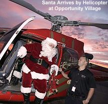 Santa arrives by helicopter at Opportunity Village