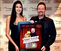 Terry Fator with Taylor Makakoa celebrating quadruple platinum DVD